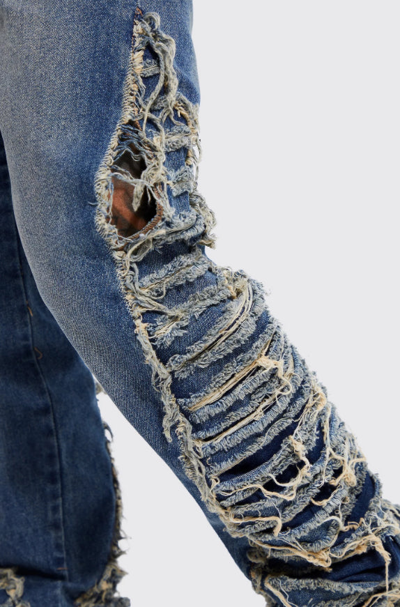 Skinny exrame distressed flare jeans in blue